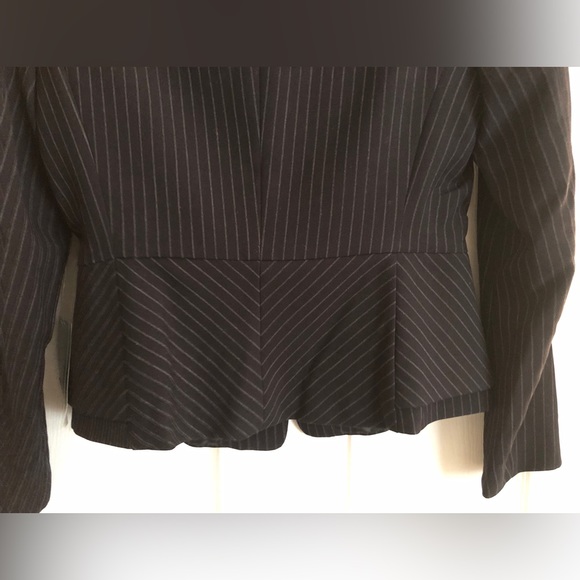 A peplum style blazer. It’s a unique look which I wished I had bought a size up. - Picture 3 of 4